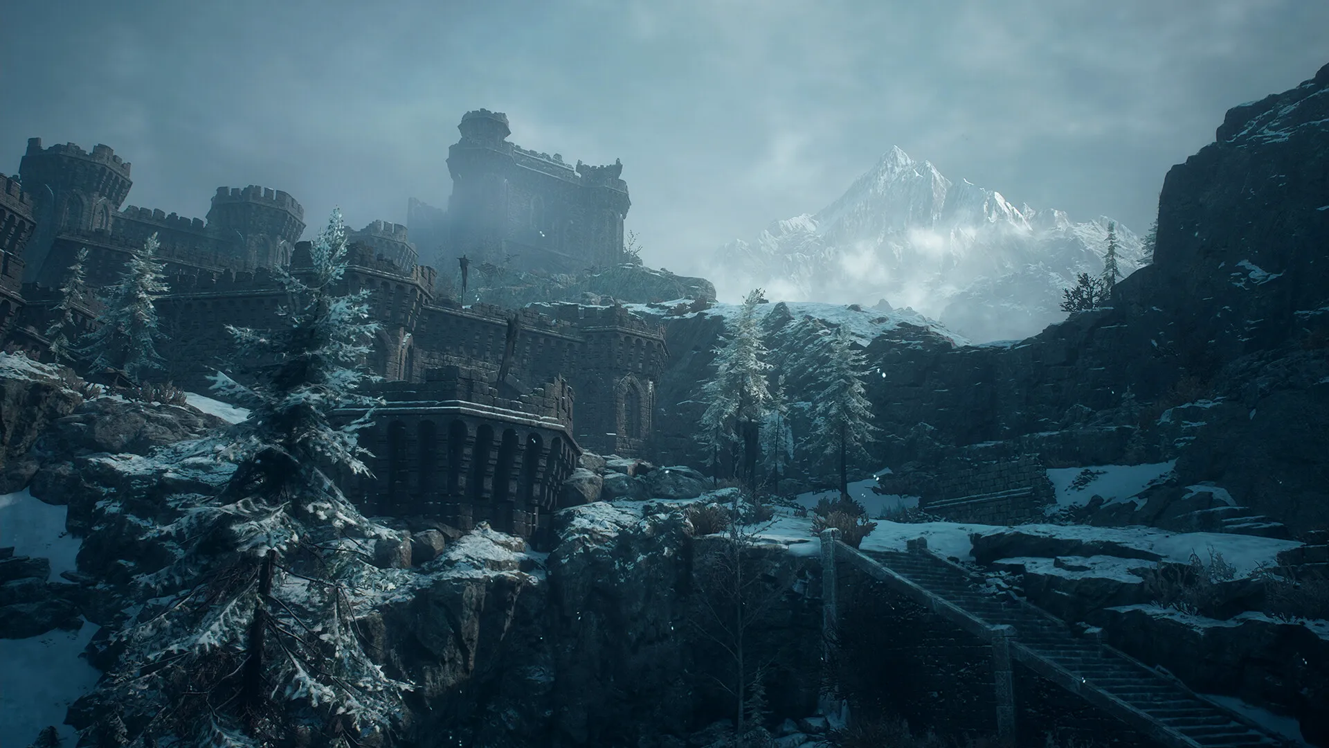 Capcom's Dark Arisen view of a snow-covered ruined fortress with trees and distant mountains.