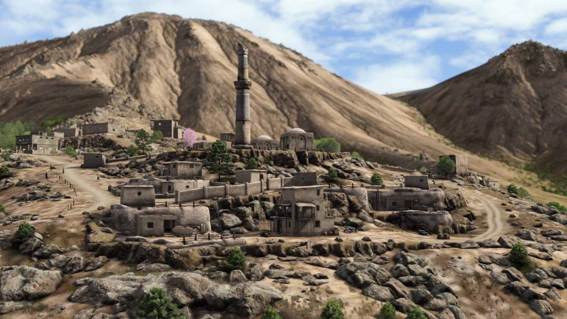 A rocky Nasdara village and minaret among desert hills.
