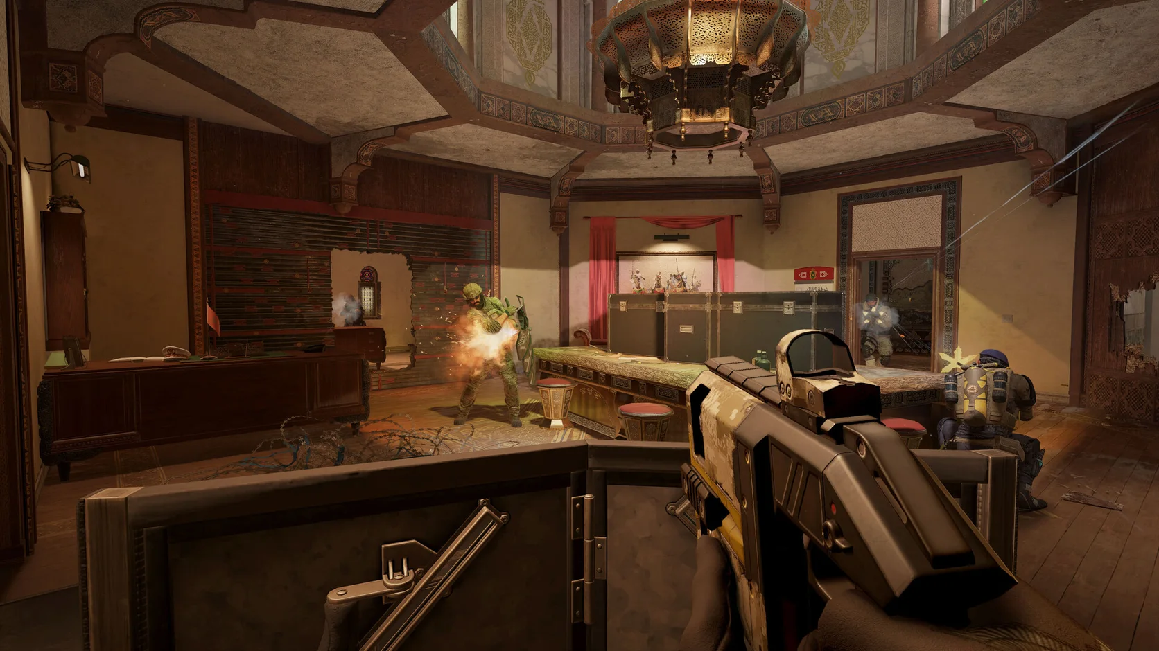 Rainbow Six Siege X gameplay showing an operator firing through a breached room as a team pushes forward
