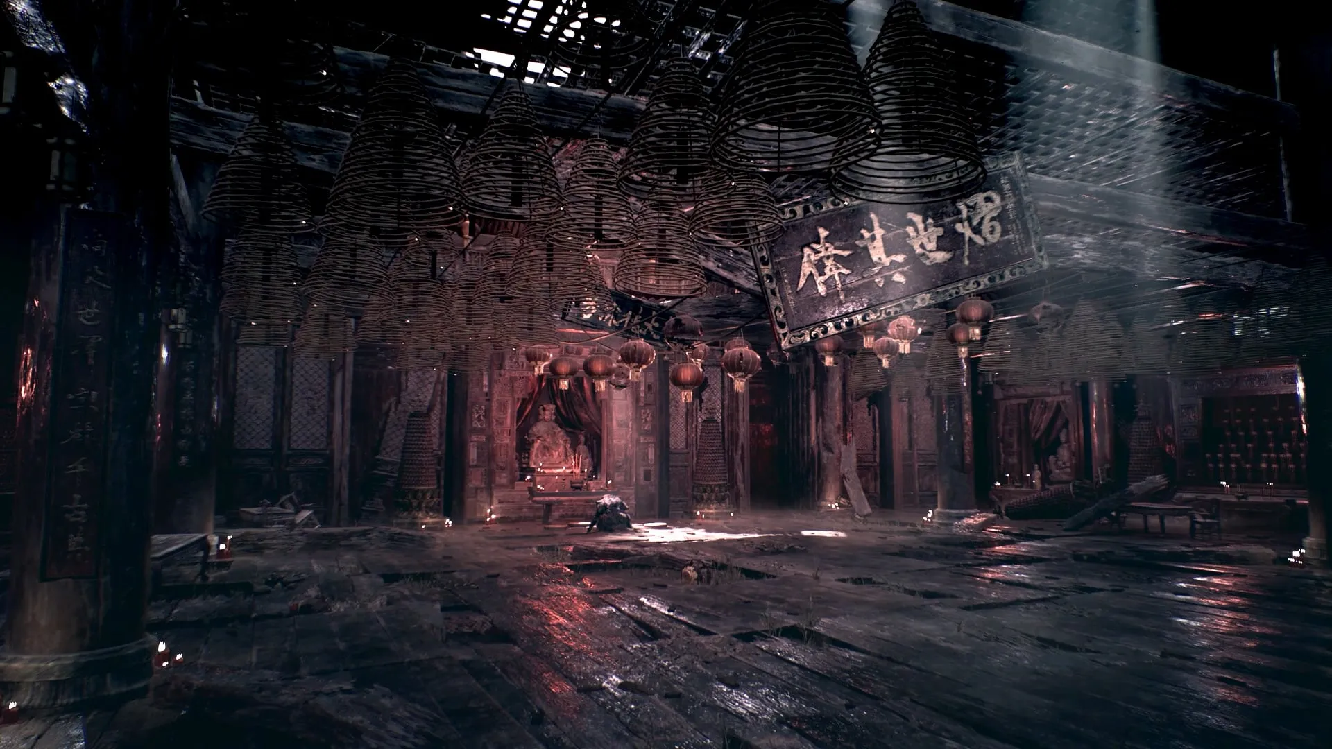 Incense coils hang above a shadowed temple interior with red lanterns and light through a damaged roof.